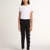 Leggings negros para niña con estrellas blancas en los laterales