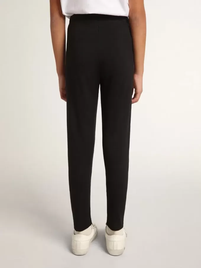 Leggings negros para niña con estrellas blancas en los laterales