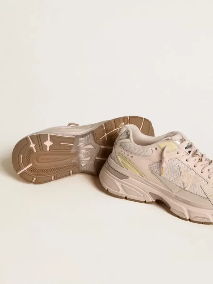 Lightstar para mujer con parte superior de piel rosa y malla y estrella rosa