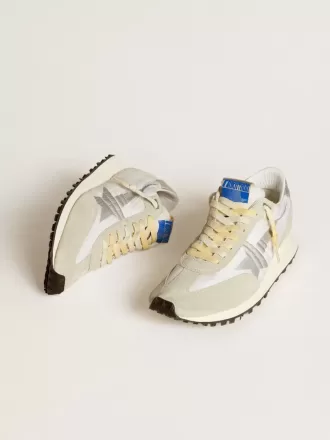 Marathon para hombre con parte superior de nailon blanco y estrella plateada.