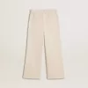 Pantalones anchos de canalé color crema con bordados para niña