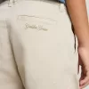 Pantalones chinos beige para niño con salpicaduras multicolores