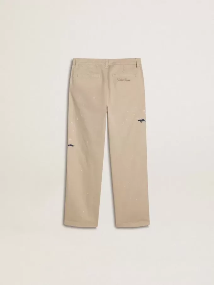 Pantalones chinos beige para niño con salpicaduras multicolores