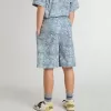 Pantalones cortos azules para niño con estampado blanco Pantalones cortos azules para niño con estampado blanco