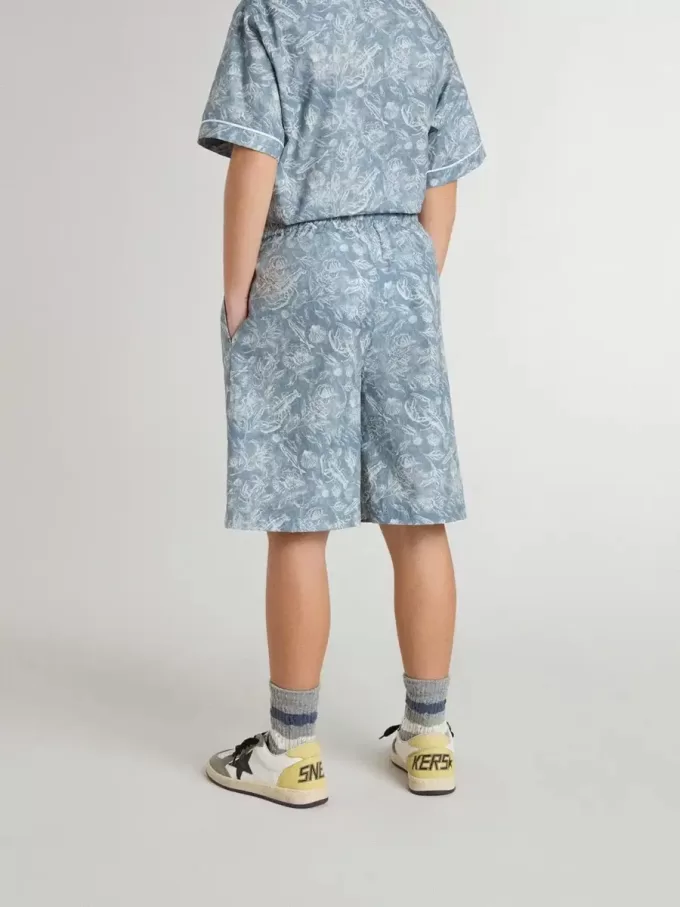 Pantalones cortos azules para niño con estampado blanco Pantalones cortos azules para niño con estampado blanco