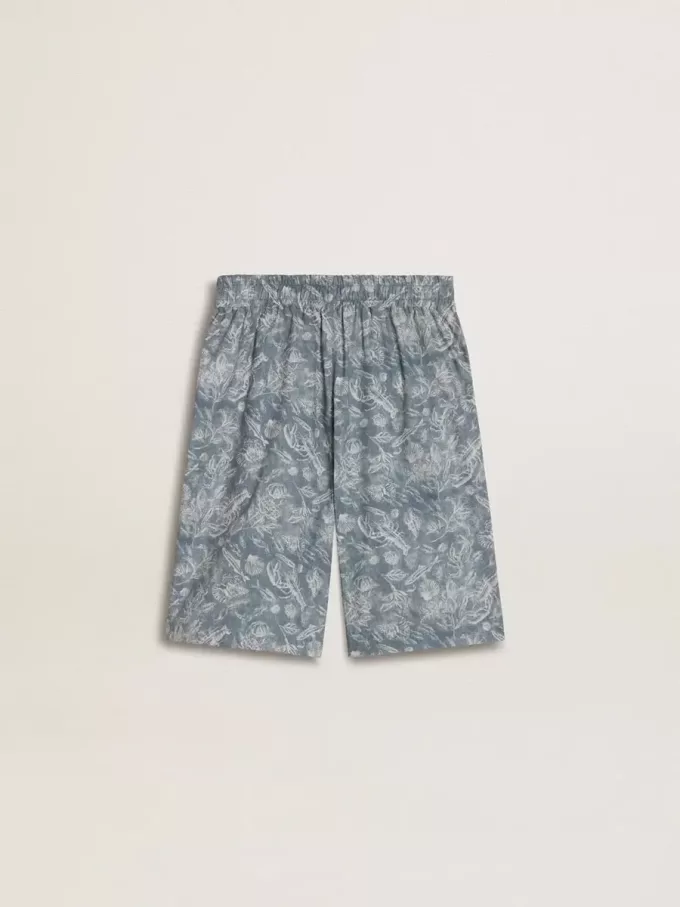 Pantalones cortos azules para niño con estampado blanco Pantalones cortos azules para niño con estampado blanco