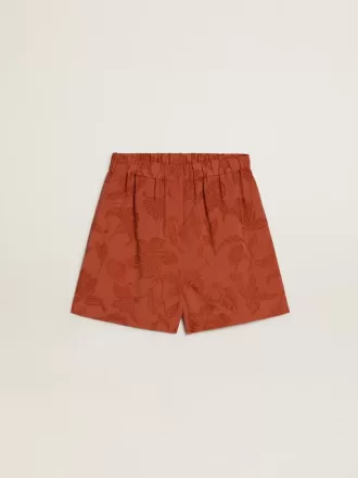 Pantalones cortos de mujer en jacquard rojo ladrillo con estampado floral marino Pantalones cortos de mujer en jacquard rojo ladrillo con estampado floral marino