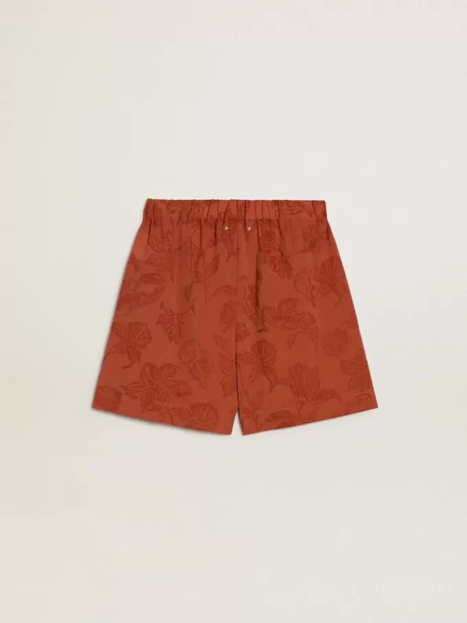 Pantalones cortos de mujer en jacquard rojo ladrillo con estampado floral marino