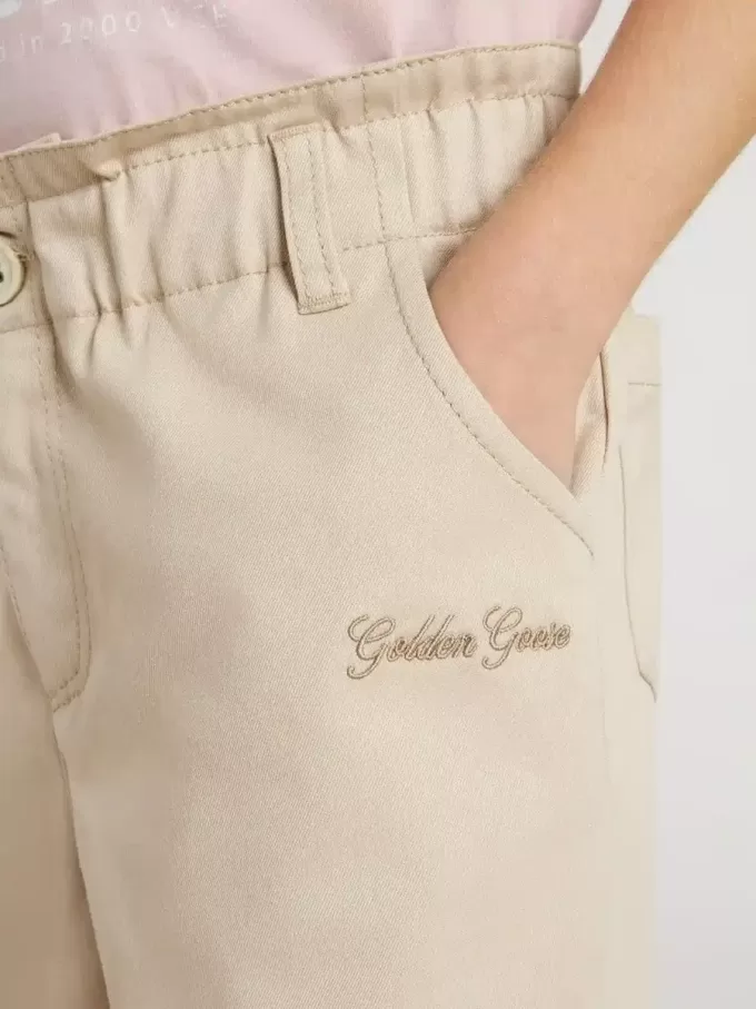 Pantalones de algodón beige con bordado para niña