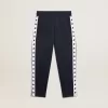 Pantalones de chándal azul oscuro con franja blanca y estrellas en contraste Pantalones de chándal azul oscuro con franja blanca y estrellas en contraste