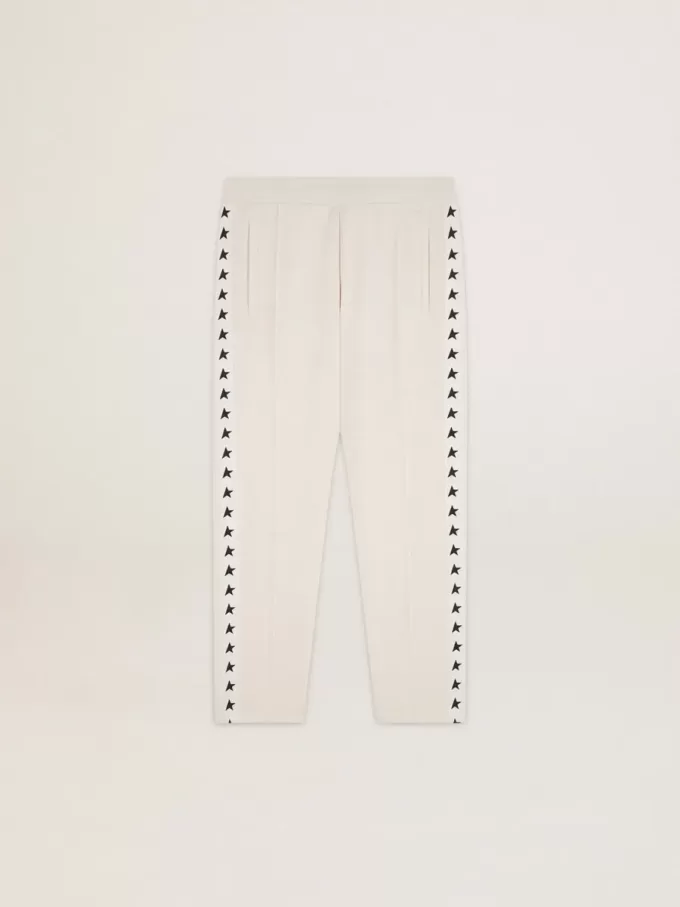 Pantalones de chándal blancos para hombre con estrellas negras en los laterales