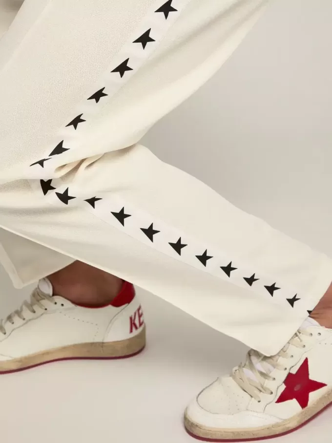 Pantalones de chándal blancos para hombre con estrellas negras en los laterales