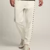 Pantalones de chándal blancos para hombre con estrellas negras en los laterales