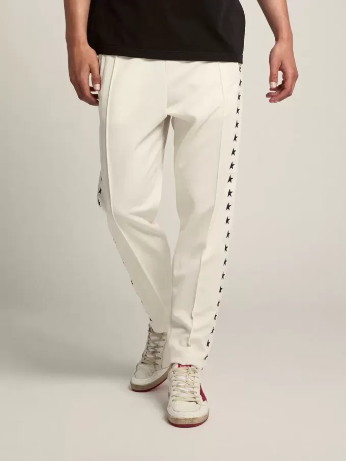 Pantalones de chándal blancos para hombre con estrellas negras en los laterales