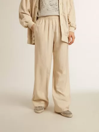 Pantalones de chándal de seda y viscosa beige claro para mujer.