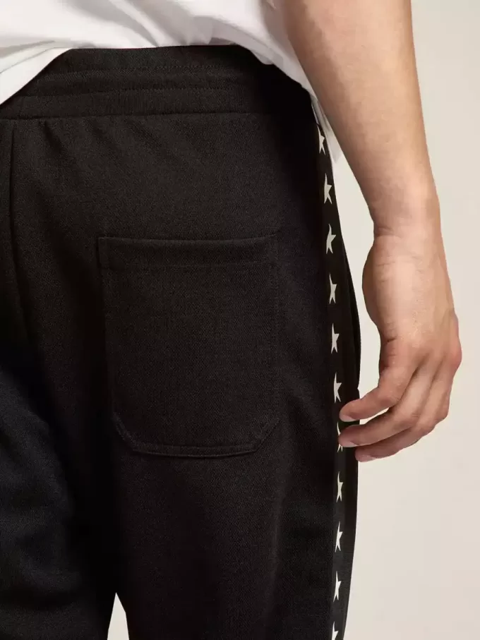 Pantalones de chándal negros para hombre con estrellas blancas en los laterales Pantalones de chándal negros para hombre con estrellas blancas en los laterales