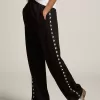 Pantalones de chándal negros para mujer con estrellas blancas en los laterales