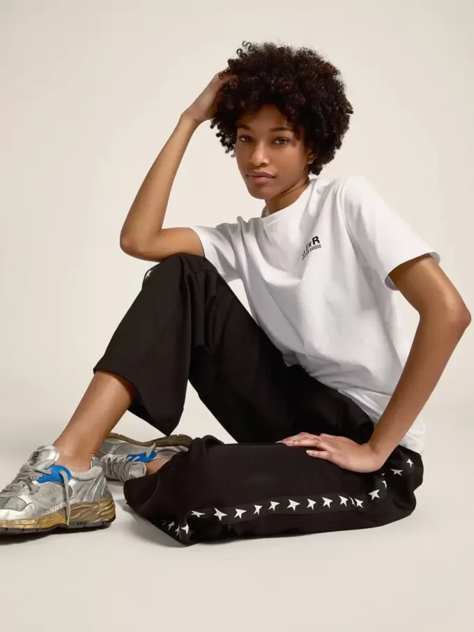 Pantalones de chándal negros para mujer con estrellas blancas en los laterales