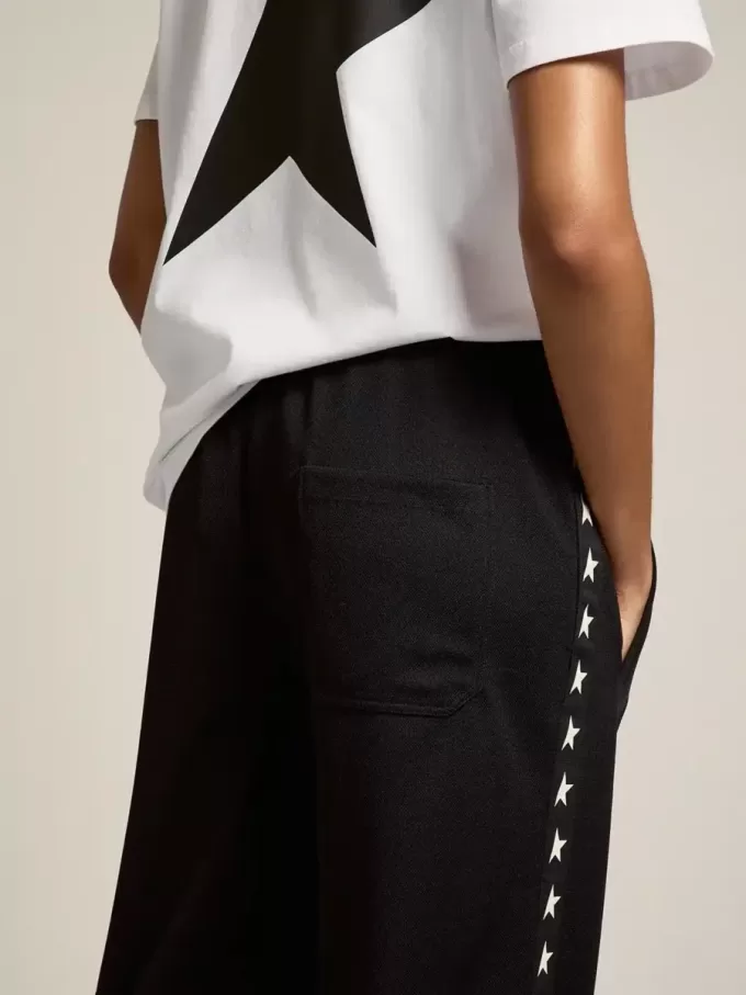 Pantalones de chándal negros para mujer con estrellas blancas en los laterales