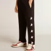Pantalones de chándal negros para niño con estrellas blancas