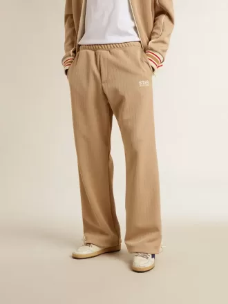 Pantalones de chándal para hombre en color beige claro con logotipo blanco