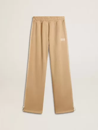 Pantalones de chándal para mujer en color beige claro con logotipo blanco