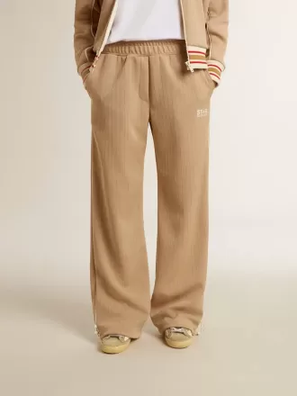 Pantalones de chándal para mujer en color beige claro con logotipo blanco