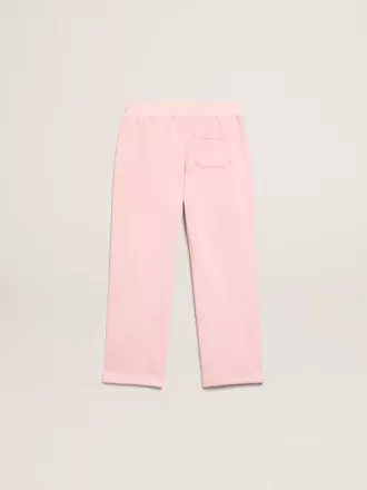 Pantalones de chándal rosas con estrella brillante en la parte delantera.