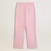Pantalones de chándal rosas con estrella brillante en la parte delantera.
