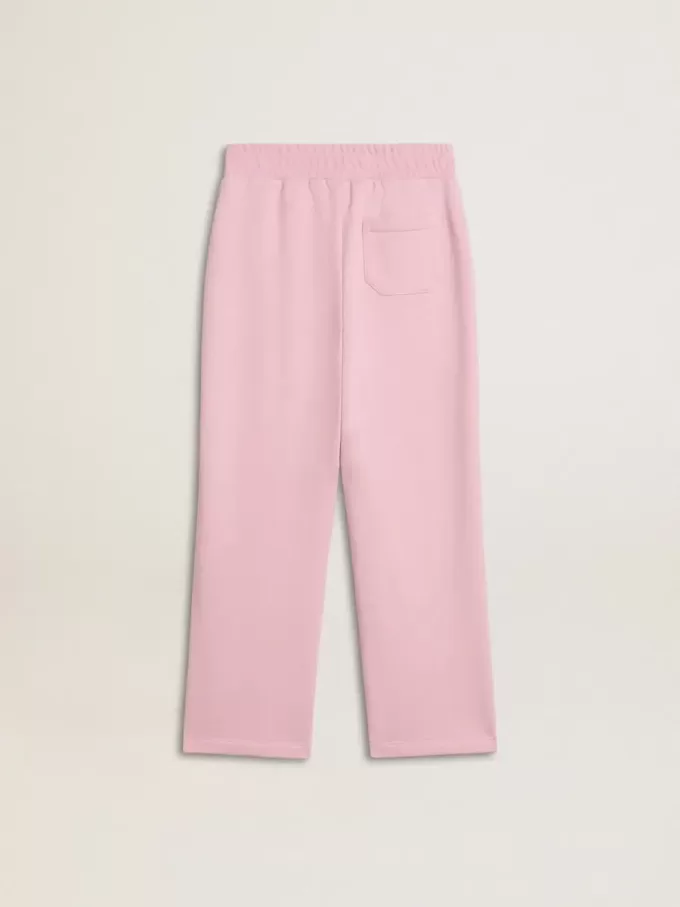 Pantalones de chándal rosas con estrella brillante en la parte delantera.