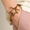 Pulsera con cadena decreciente en oro antiguo y cierre en forma de estrella
