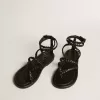 Sandalias planas Penelope para mujer en piel negra.