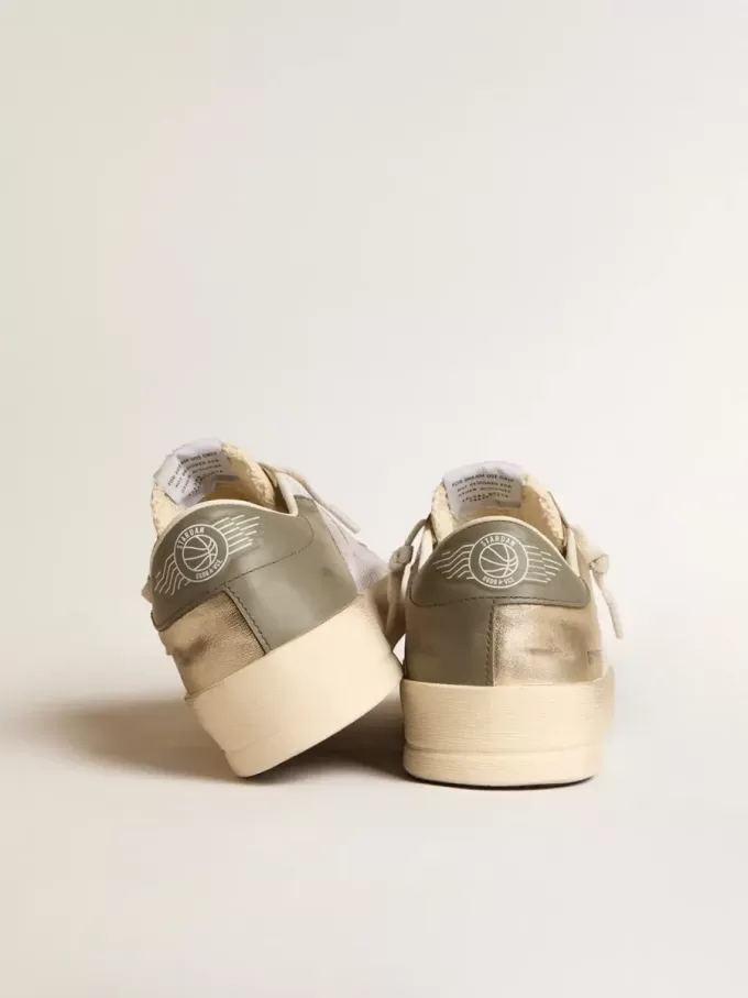 Stardan en malla blanca con estrella naranja e inserciones de piel platino Stardan en malla blanca con estrella naranja e inserciones de piel platino