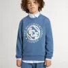 Sudadera azul para niños con parches blancos en relieve Sudadera azul para niños con parches blancos en relieve