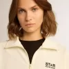 Sudadera blanca con cremallera para mujer con franja blanca y estrellas negras