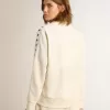 Sudadera blanca con cremallera para mujer con franja blanca y estrellas negras