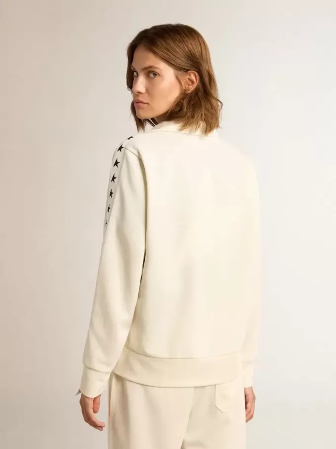 Sudadera blanca con cremallera para mujer con franja blanca y estrellas negras