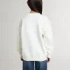 Sudadera blanca para niña con inscripción multicolor «Golden» en la parte delantera