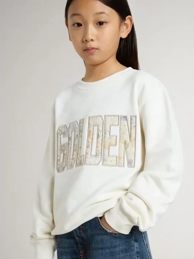 Sudadera blanca para niña con inscripción multicolor «Golden» en la parte delantera