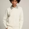 Sudadera con cremallera Denise Star Collection en color blanco papiro con cuello de cristal