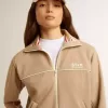 Sudadera ligera beige con cremallera y logotipo blanco para mujer Sudadera ligera beige con cremallera y logotipo blanco para mujer