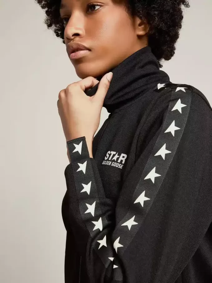 Sudadera negra con cremallera y estrellas blancas para mujer