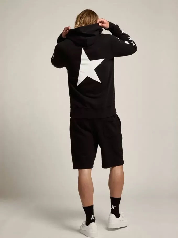 Sudadera negra de la colección Alighiero Star con estrellas blancas en contraste.