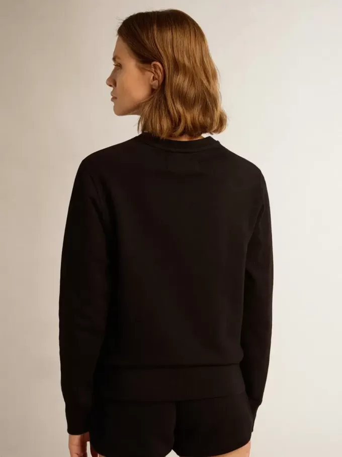 Sudadera negra de la colección Athena Star con estrella tono sobre tono en la parte delantera.