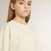 Sudadera para niña en color crema con letras bordadas