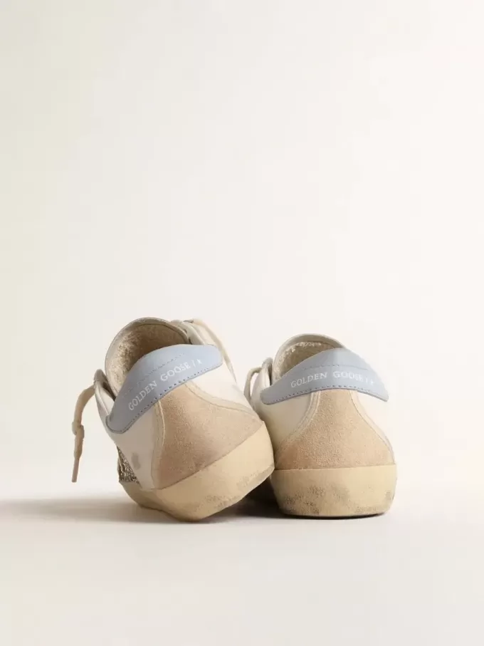 Super-Star de origen biológico con purpurina plateada y estrella de cuero amarillo