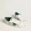 Super-Star LTD para hombre en ante blanco y malla con estrella de piel verde y lengüeta plateada en el talón