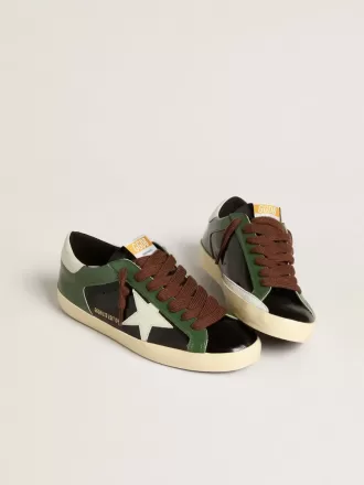 Super-Star LTD para hombre en piel laminada negra con estrella y lengüeta en el talón de piel blanca.