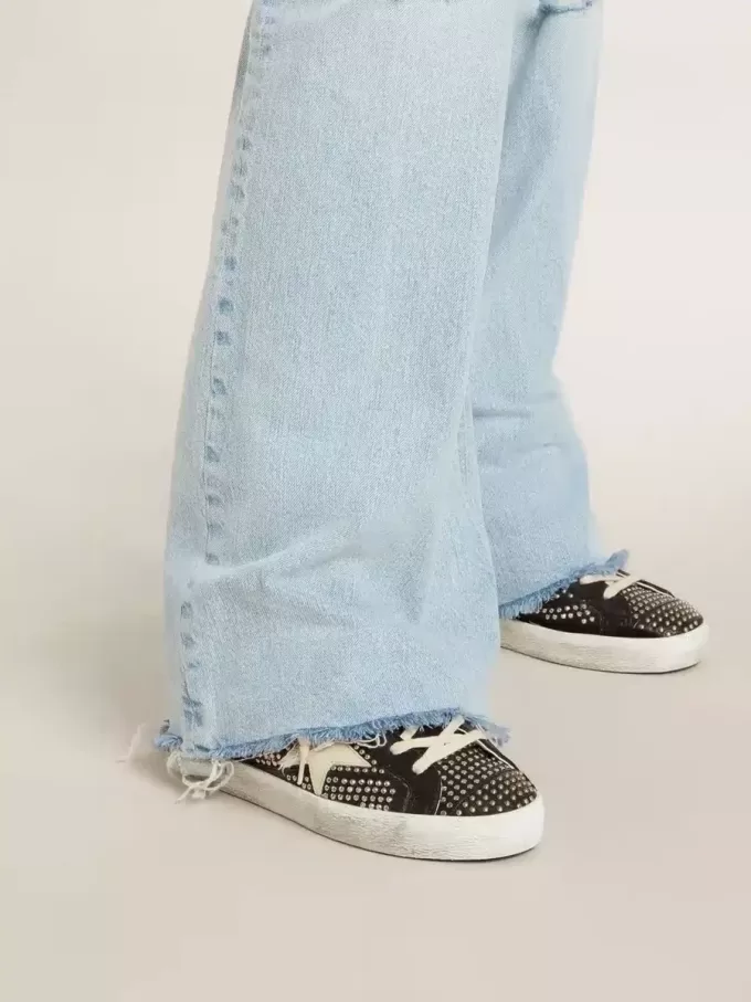 Super-Star para mujer en napa negra con tachuelas y estrella de piel blanca