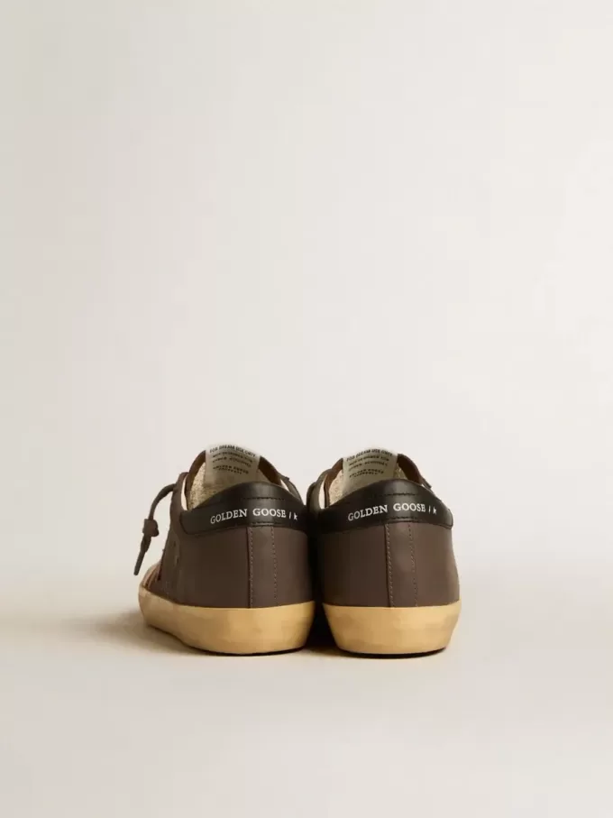 Super-Star Penstar LTD para mujer en piel marrón con estrella de ante rosa Super-Star Penstar LTD para mujer en piel marrón con estrella de ante rosa